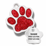 Red glittery paw-shaped dog tag with engraving
